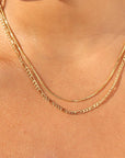 14k gold fill Gigi chain paired with the Delaney chain on model