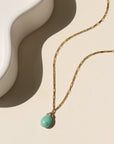 Agave Necklace with a faceted sage green turquoise teardrop pendant on a reflective gold filled box chain, designed for everyday wear and layering.