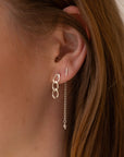 model wearing 14k gold fill chain earrings with pearl accent and bar stud earring