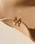 Ava Pearl Stud Earrings with minimalist gold settings and elegant freshwater pearls.