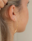 model wearing 14k gold fill large ebb + flow slides