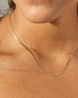 model wearing 14k gold fill herringbone chain necklace