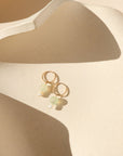 14k gold fill hoops with chalcedony and ethiopian opal beads on a light dish