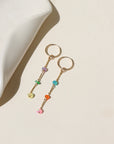 Disco Drop Earrings with colorful opals hanging from links.