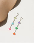 Disco Opal Earrings featuring six multicolored opals on a bar, dot, and dash chain design in sterling silver