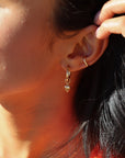 model wearing heart hoop charm in 14k gold fill on classic 14k gold fill hoop paired with 14k gold fill ear cuff