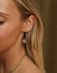 Handcrafted gold hoops adorned with faceted crystals for a subtle shimmer and timeless look.