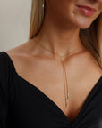 model wearing 14k gold fill chain lariat with bead accents