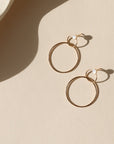 14k Gold fill stud earrings with handmade circle drops on a light background
