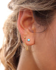 Model wearing 14k gold fill small curb chain stud earrings with turquoise stud earrings