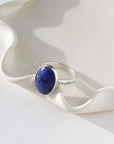 Lapis Lazuli Gemstone Ring in sterling silver. This ring features a thick silver hammered band with a 12x16mm Lapis gemstone.