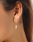 Mini Bow Earrings by token jewelry on model