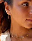 model wearing 14k gold fill Alex chain studs.