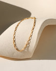 Nova Chain Bracelet in 14k gold fill or sterling silver, featuring a sleek box chain that reflects light with every movement