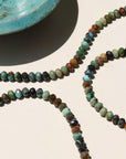 Taos Bracelet featuring multicolored turquoise beads in soft blues, greens, and browns with a gold filled spring clasp.