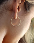 Token jewelry petite maeve hoops in 14k gold fill on a model