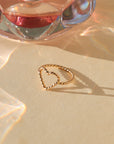 14k gold fill heart ring made with spiral wire in the sunlight