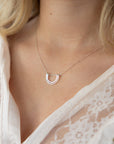 model wearing sterling silver hammered pendant necklace