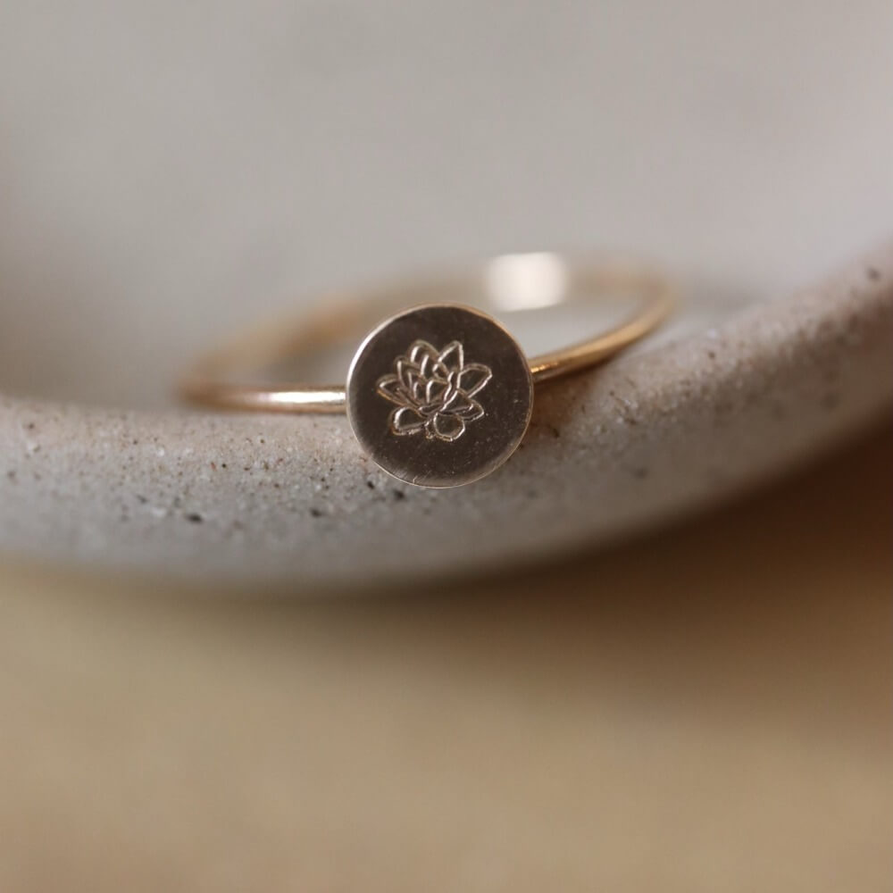 Birth flower ring featuring a Lotus flower for the month of August. Mother&#39;s Day Gifts, Personalized Jewelry, Handmade Jewelry, Gold Ring that&#39;s flower stamped by Token Jewelry in Eau Claire, WI