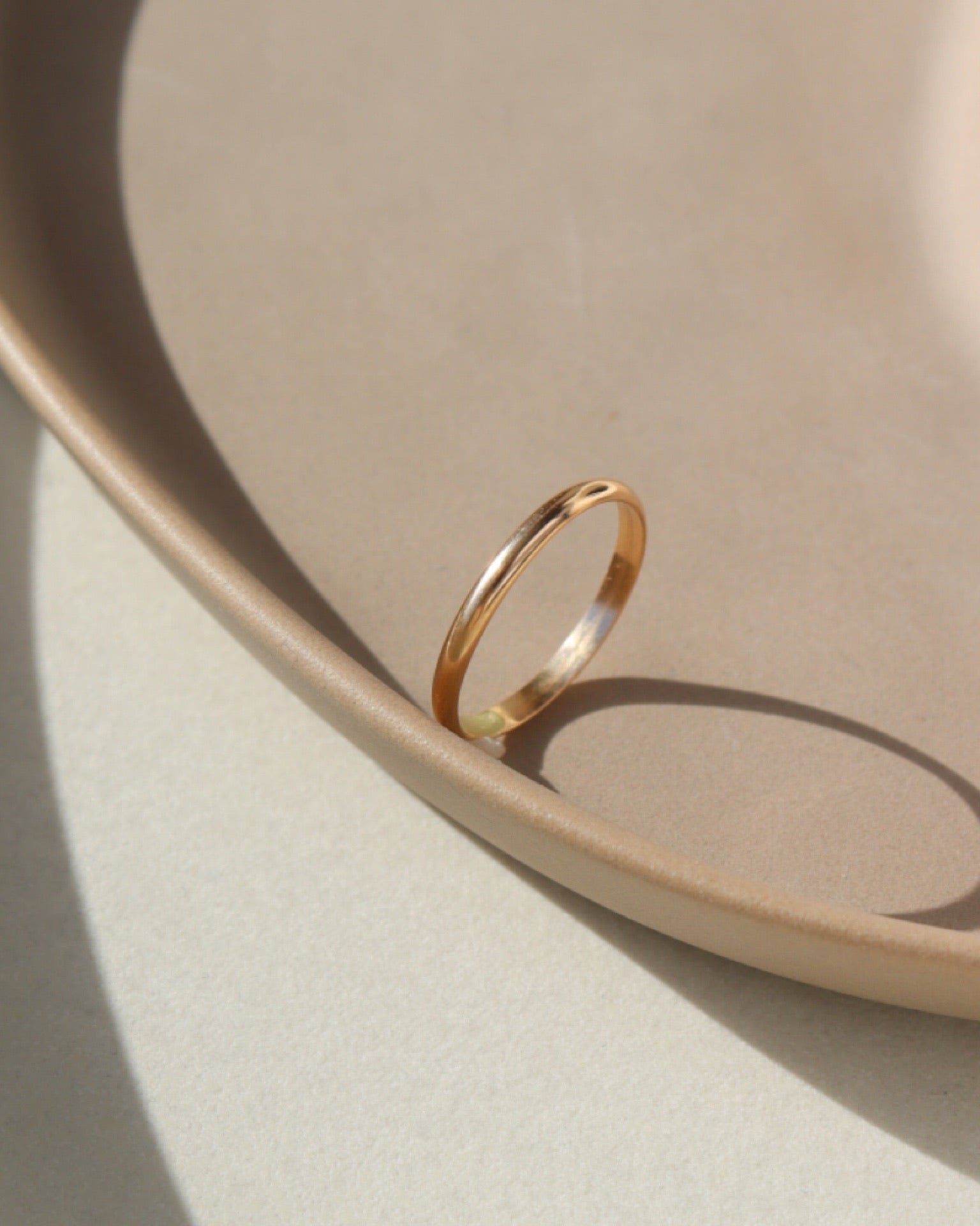 smooth circular ring in 14k gold or sterling silver, handmade by Token Jewelry in Eau Claire, Wisconsin