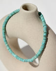 Turquoise Beaded Bracelet on a tan pot