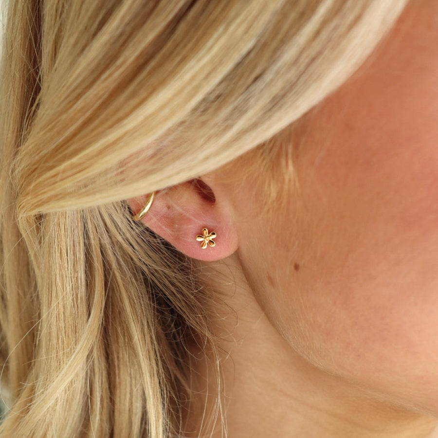 Model Wearing Daisy Studs - Token Jewelry - 14k gold fill stud earring - hypoallergenic - tiny flower earring -
