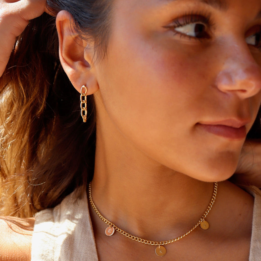 model wearing 14k gold fill Alex chain studs.