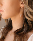 Model wearing 14k gold fill Juno earrings