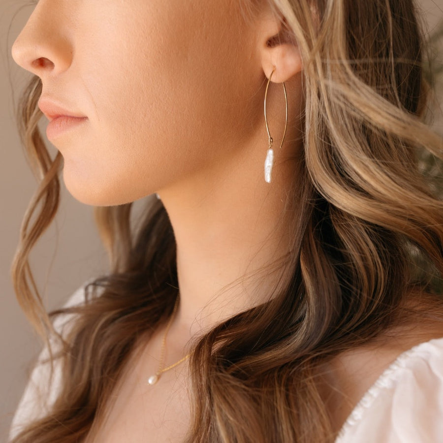 Model wearing 14k gold fill Juno earrings