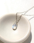 Sterling silver Celine necklace with moonstone in small stone dish.