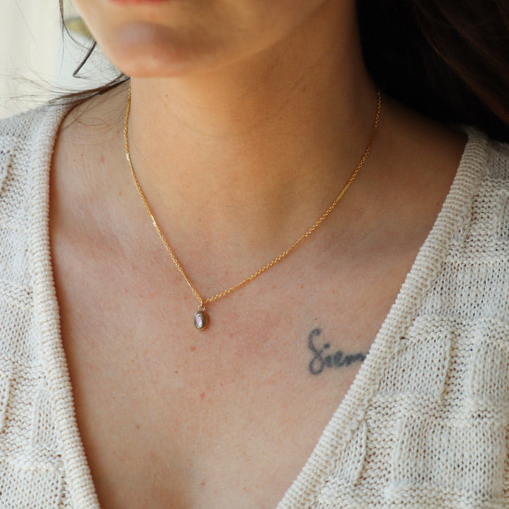 model wearing 14k gold fill necklace with abalone pendant charm
