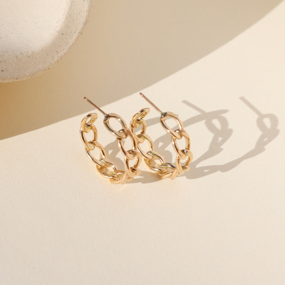 Alex Hoops — sculptural 14K gold fill or sterling silver hoops, lightweight and modern, perfect for layering or wearing solo.