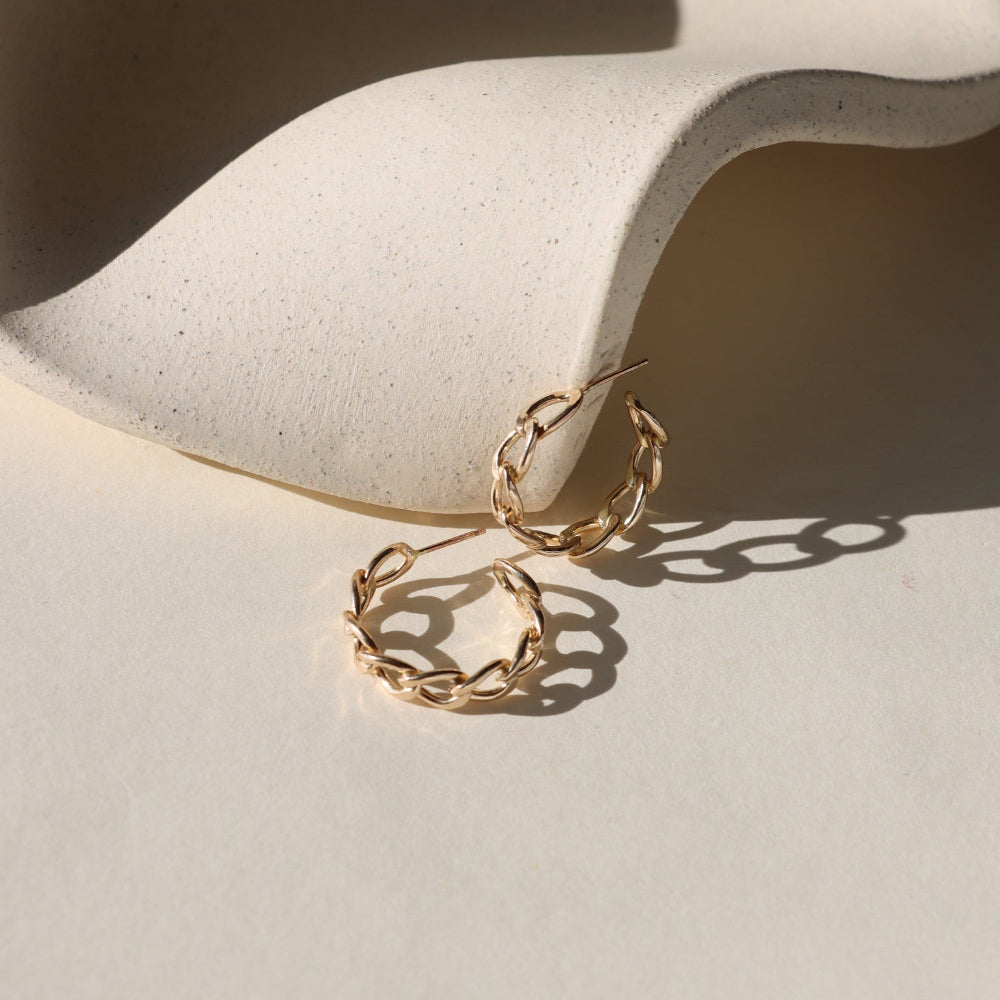Alex Hoops — sculptural 14K gold fill or sterling silver hoops, lightweight and modern, perfect for layering or wearing solo.