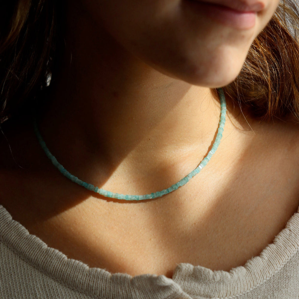 Model wearing a fully beaded Amazonite necklace with a 14k gold fill standard clasp. 