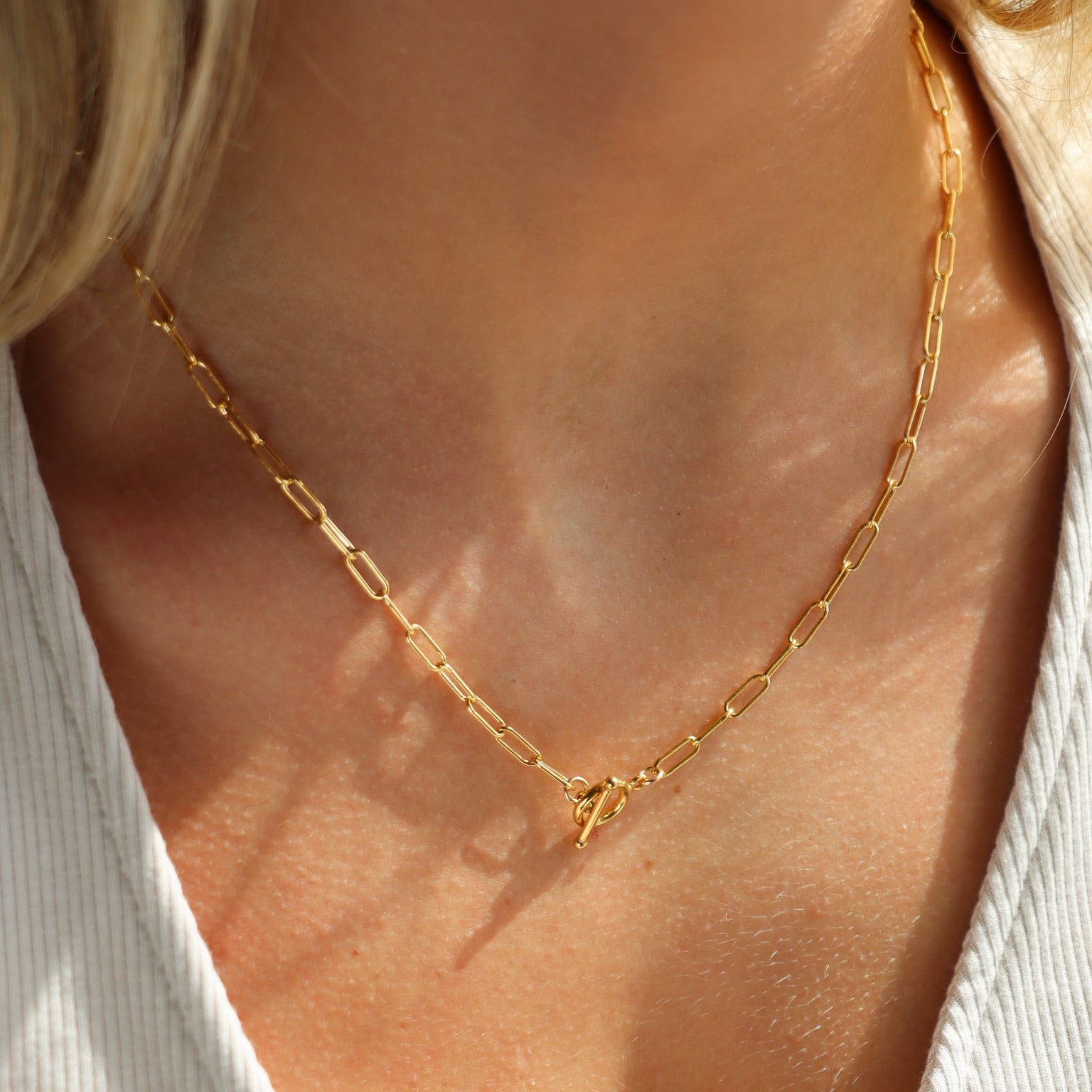 model wearing 14k gold fill paperclip chain necklace with toggle clasp