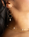 Ava Pearl Drop Earrings with minimalist gold ear wires and dangling freshwater pearls.