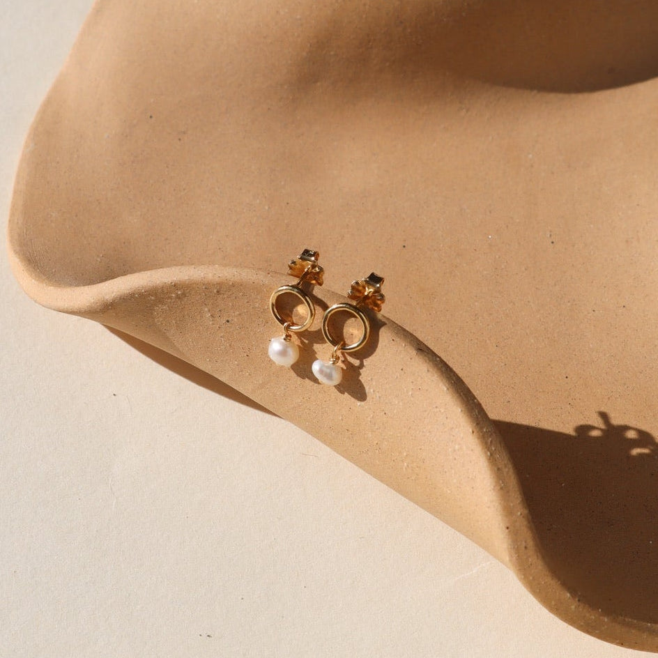 Ava Pearl Stud Earrings with minimalist gold settings and elegant freshwater pearls.
