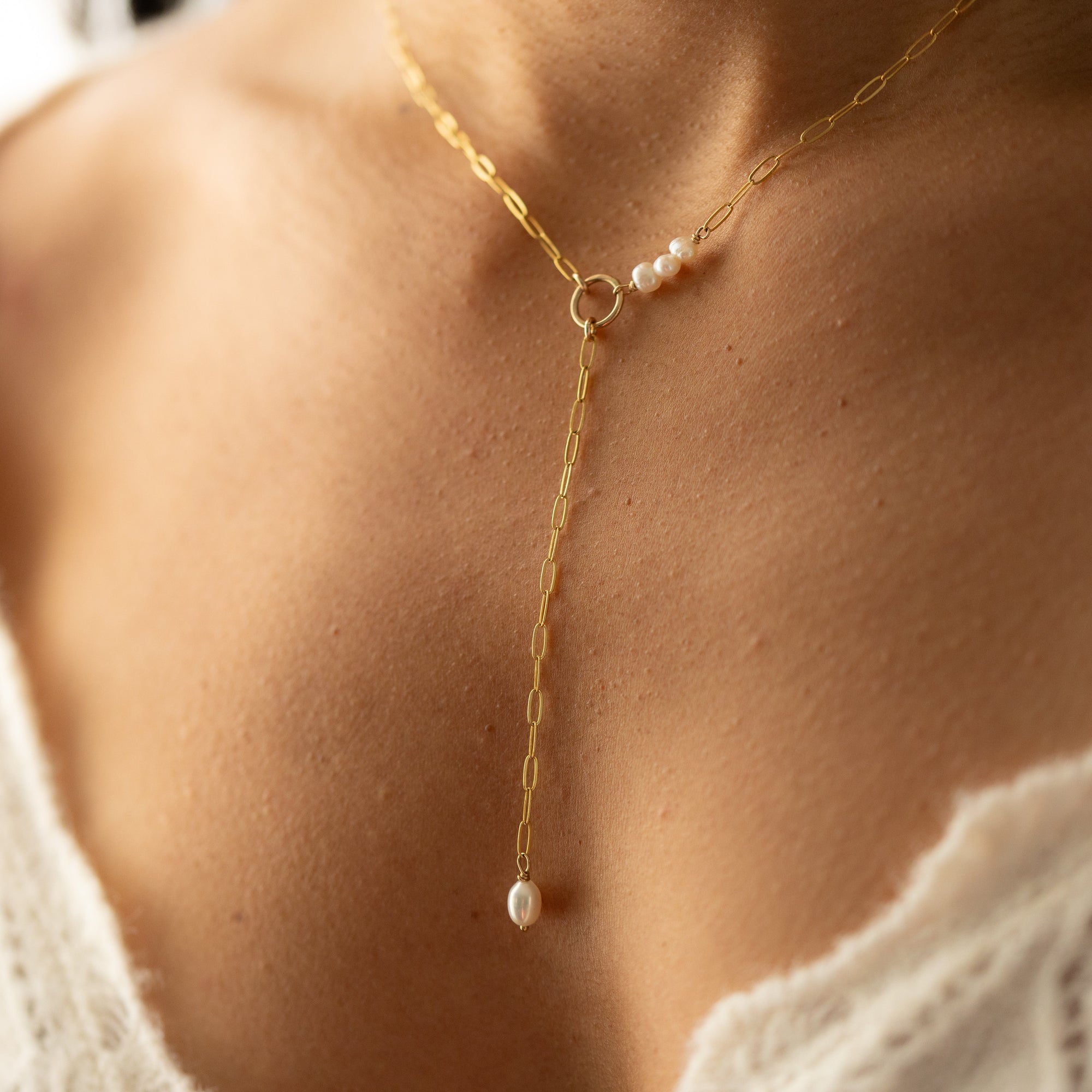 Elegant Ava Pearl Necklace crafted in 14K gold fill, showcasing timeless simplicity with a glowing freshwater pearl.