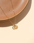14k gold fill dainty chain necklace with 2 14k gold fill small disk charms that have flowers hand stamped 
