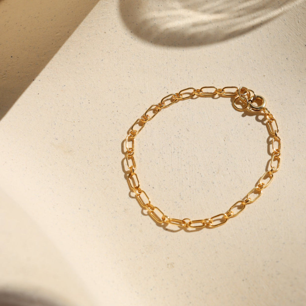 14k gold fill chain bracelet on a light dish