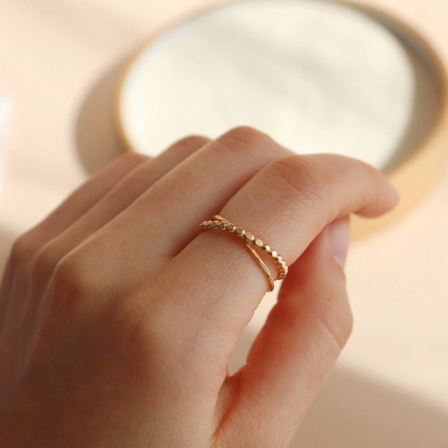 beaded wire ring and simple hammered stacking band entwined together. 14k gold fill or sterling silver. Handmade by Token Jewelry in Eau Claire, WI
