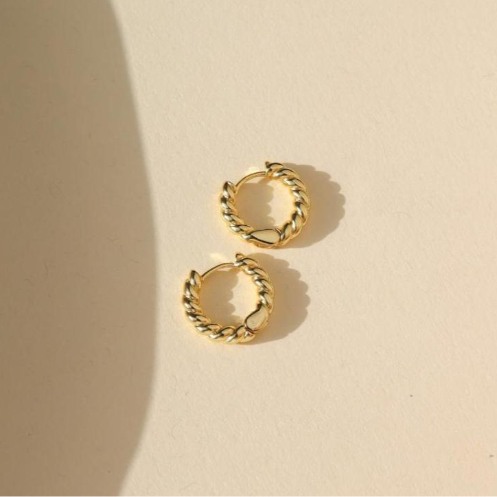 14k gold fill textured chunky hoops on a light background