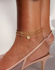 Model wearing a 14k gold fill Delaney anklet