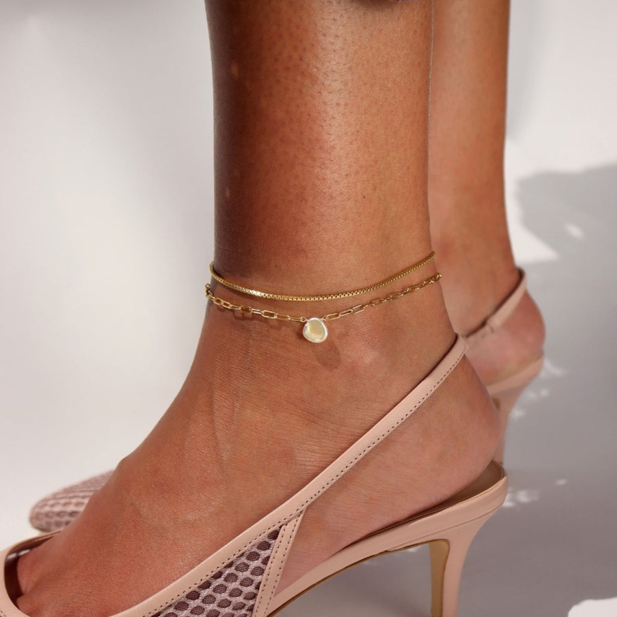 Model wearing a 14k gold fill Delaney anklet