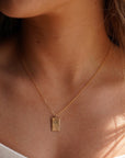 Model wearing 14k gold fill Box charm necklace