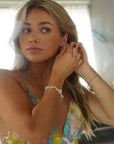 Model wearing 14k gold fill Pearl Petals Bracelet