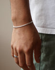 Model wearing 925 sterling silver mens cater bracelet