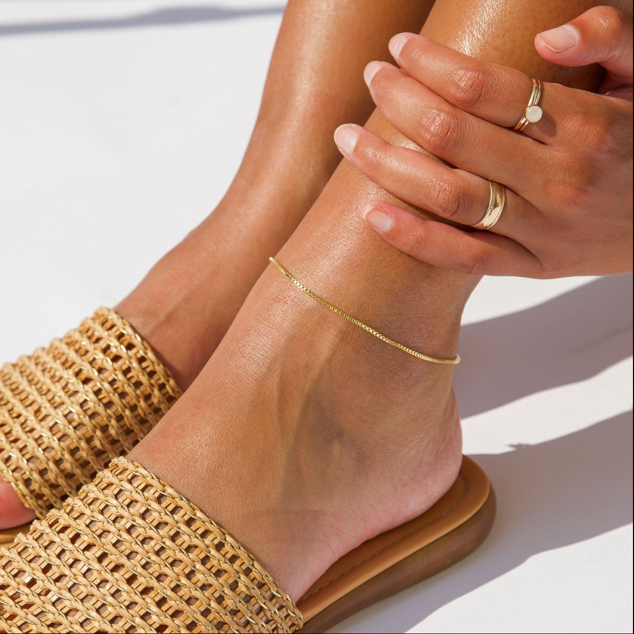 model wearing 14k gold fill box chain anklet 