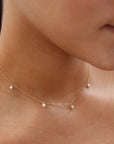 model wearing 14k gold fill dainty chain necklace with pearls 