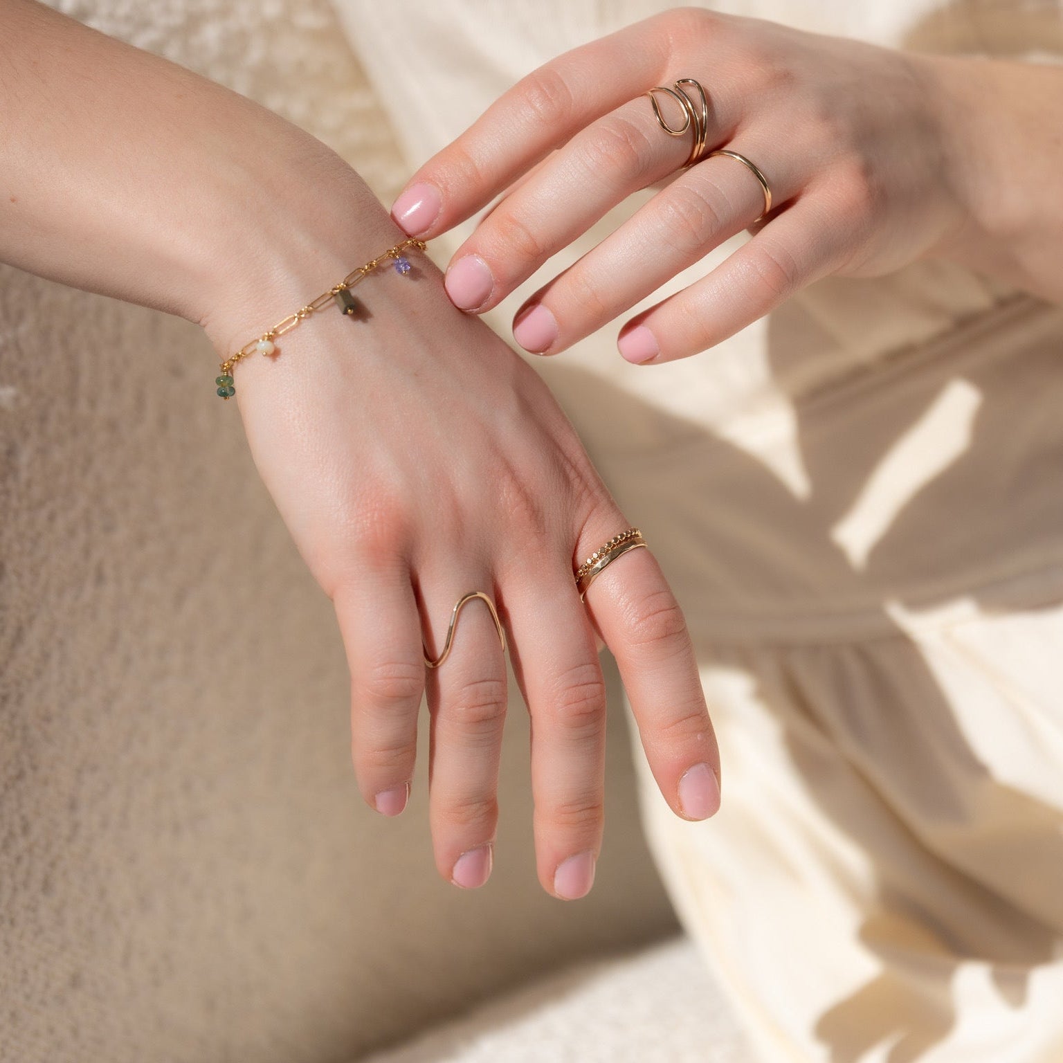 model wearing 14k gold fill charm bracelet
